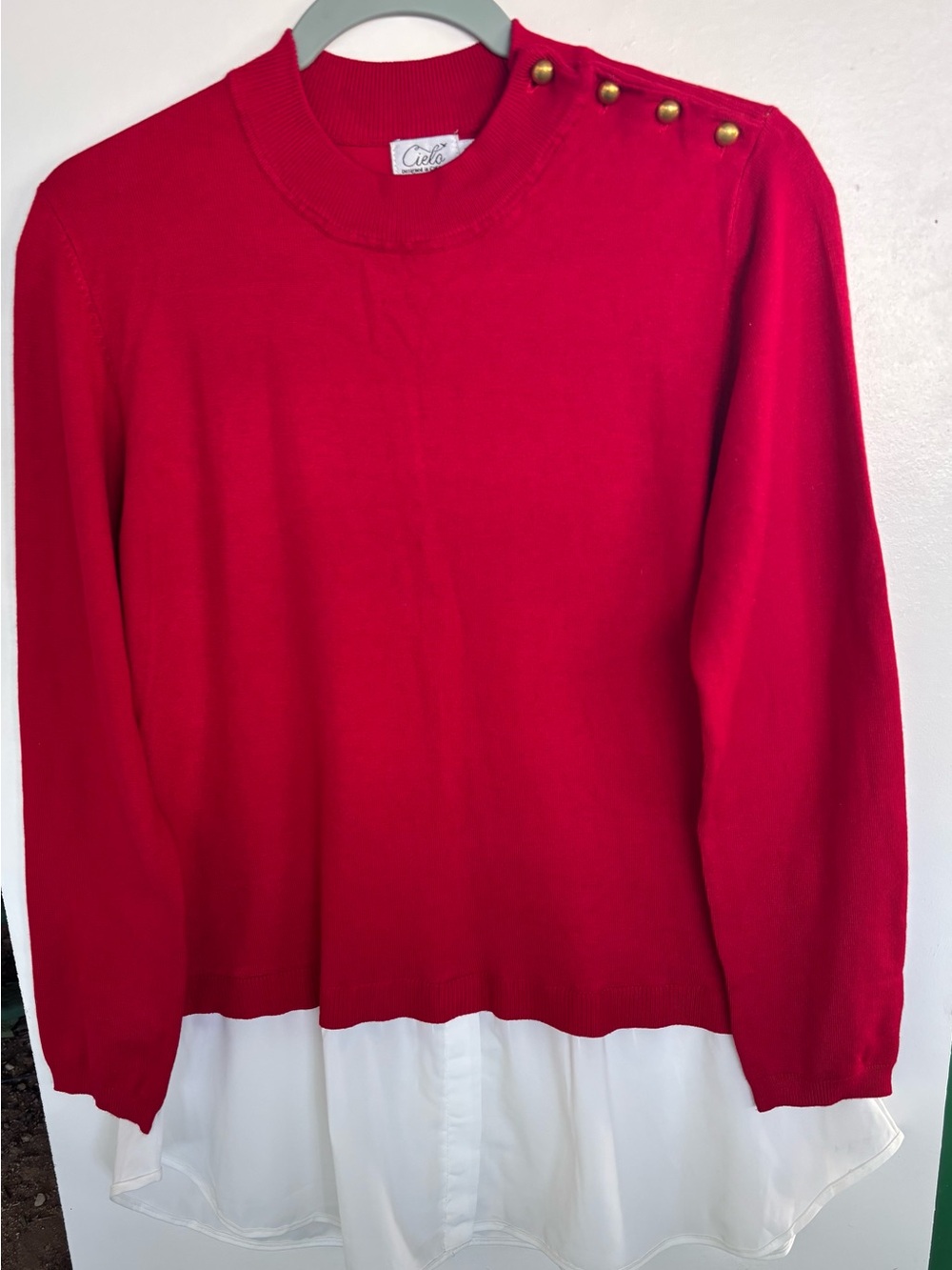 Cielo Red Crewneck Sweater with Gold Shoulder Buttons and White Layered Hem